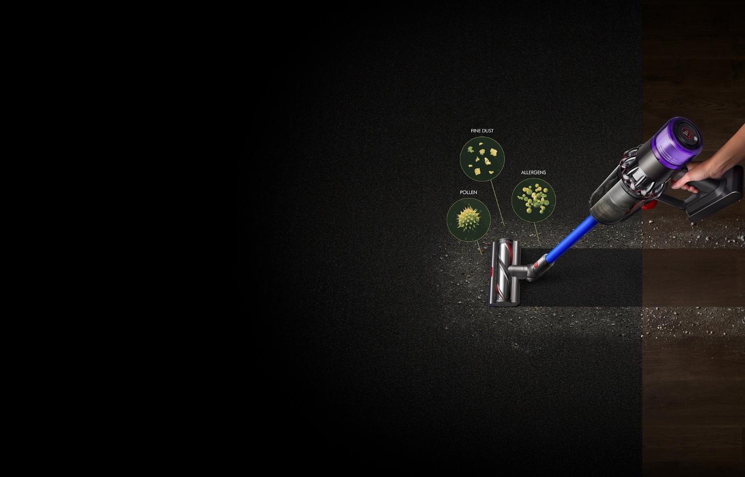 A Dyson V11™ vacuum picking up fine dust, allergens and pollen from the floor.